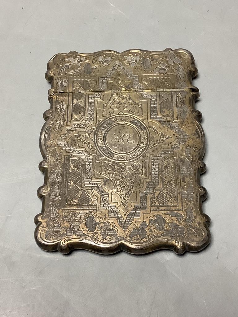 A Victorian engraved silver card case, George Unite, Birmingham, 1877, 10.1cm, together with a white metal and niello small cup and small 925 tree charm.